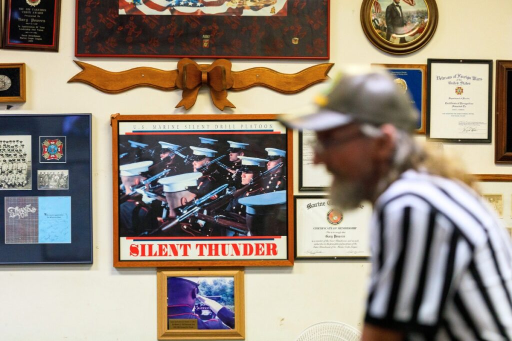 Military regalia, news clippings and other artifacts cover the walls of Veterans of Foreign Wars Post 2811 off Waldo Road in Gainesville, Florida, where members gather each Sunday afternoon for a weekly bingo game.
