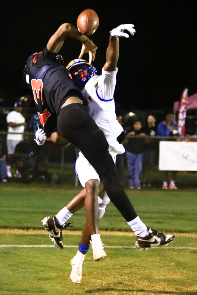 Newberry's Demetrius Debose (4) gets called for a pass interference on Hawthorne's Mikel Sesler (13) in the third quarter on Friday. Photo by C.J. Gish