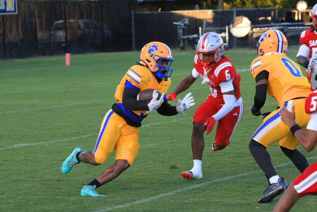 Newberry's Jamarcus Wimberly runs the ball against the Raiders. Photo by Seth Johnson