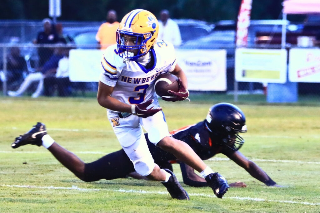 Newberry's Keyondre Williams (3) with a first-quarter punt return against Hawthorne on Friday. Photo by C.J. Gish