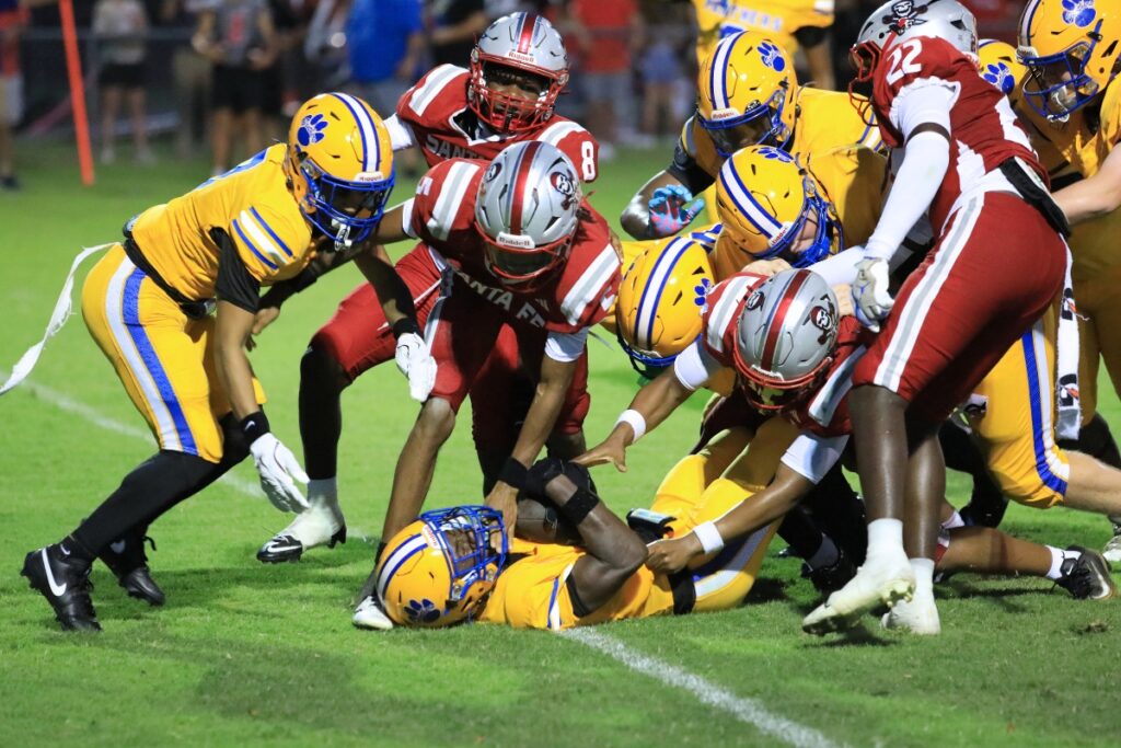 Newberry's Zaden Wilcox snags a touchdown against Santa Fe. Photo by Seth Johnson