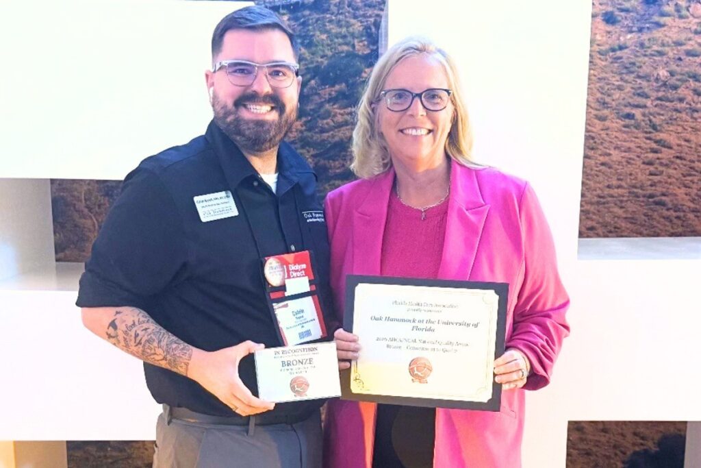 Oak Hammock's Calvin Reynek (left) and Sonja Donlin accepted the Bronze – Commitment to Quality Award from the American Health Care Association and National Center for Assisted Living.