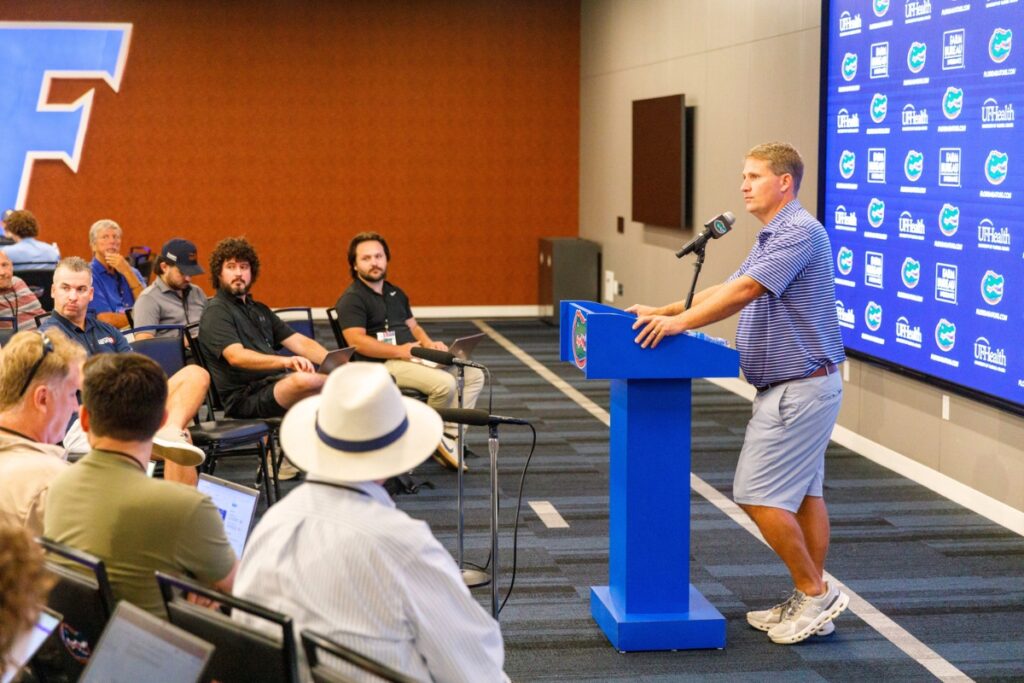 Offensive Coordinator Buster Faulkner speaks with members of the press about the upcoming football season at the Sanders Football Practice Facility in Gainesville on Tuesday.