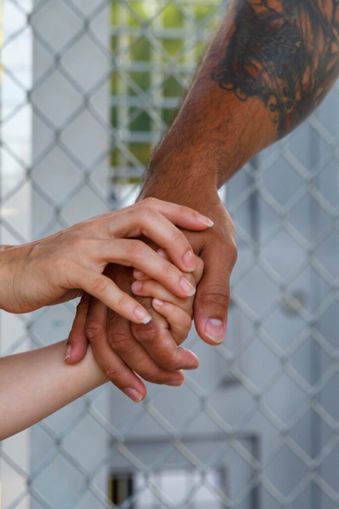 Parents and students embrace and hold hands before departing on the first day of school at Oak View K-8 School in Newberry. Photo by Walker Smith