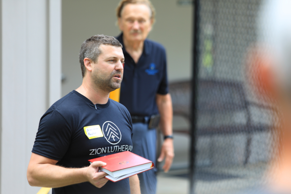 Pastor Brian Wrobel gives a blessing for the repurposed former sanctuary at Saturday's open house. 