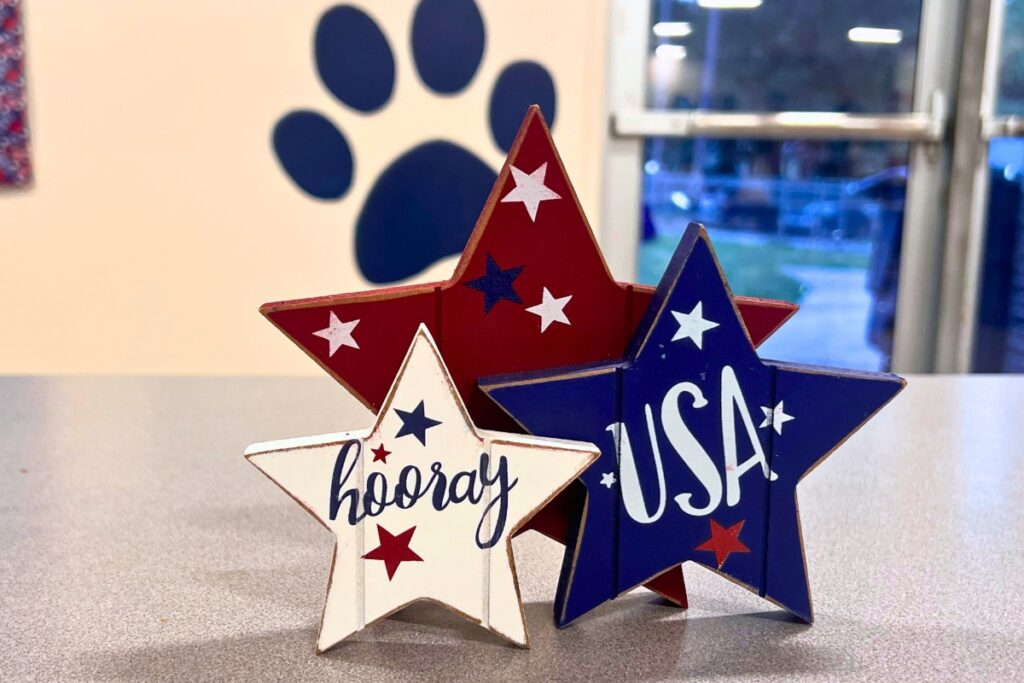 Patriotic decor, such as this wooden sign, was spread throughout the cafeteria. Photo by Nick Anschultz