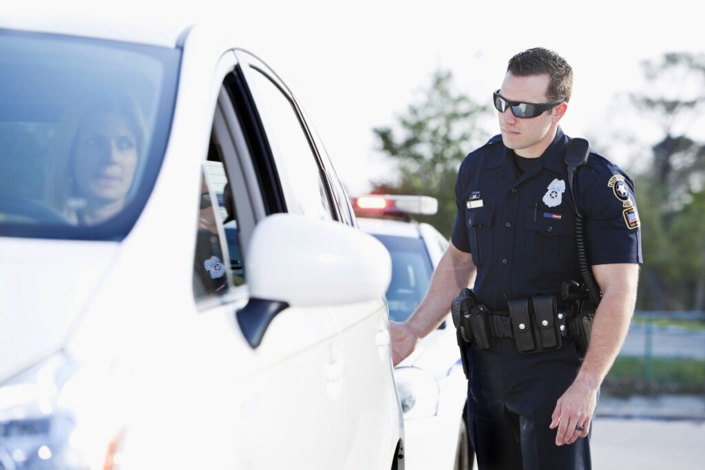 Police officer pulling over a driver.