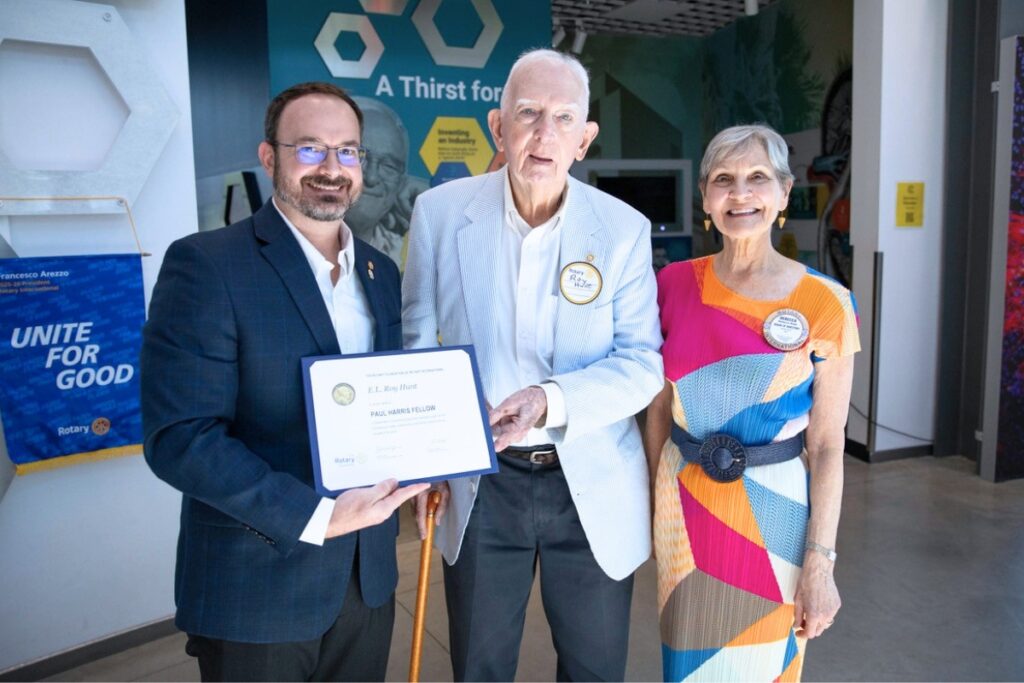 Roy Hunt, center, poses for a photo after receiving his award. With him are Rotary Club Immediate Past President Ryan Thompson and Rotary Club board member and Harn Museum Director Emerita Rebecca Nagy. Photo by Jamey Harvey