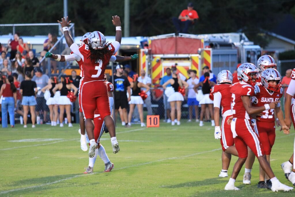 Santa Fe's Jasiah Powell celebrates the game's first touchdown. Photo by Seth Johnson
