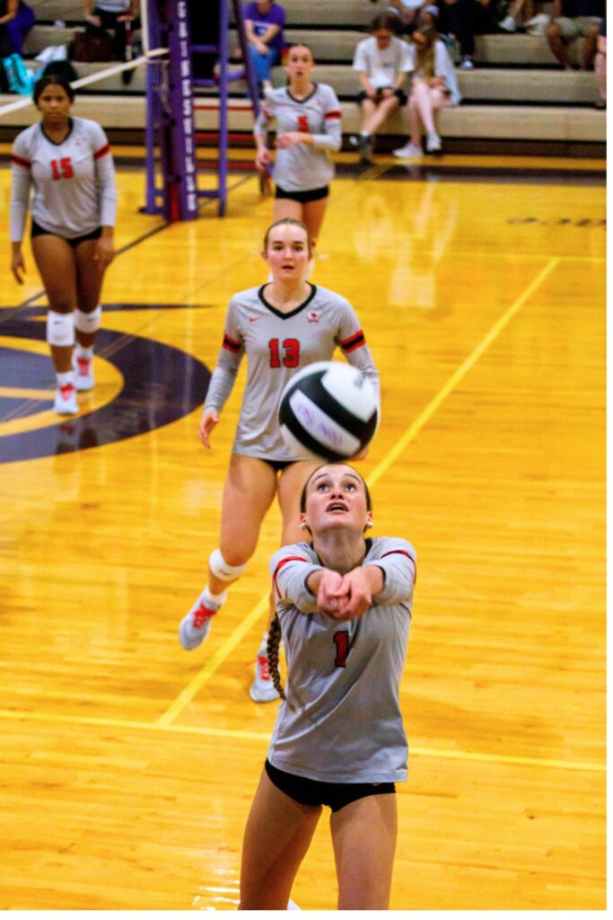 Santa Fe's Lalyn Sikes (1) with a dig against Gainesville on Tuesday. Photo by Walker Smith