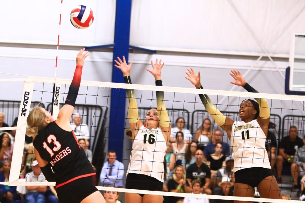 Santa Fe's Taylor Sembower (13) with a hit against Buchholz's Delaney DeRemer (16) and Demmi Strappy (11) at the Crafty Gemini Preseason Showdown on Thursday. Photo by C.J. Gish