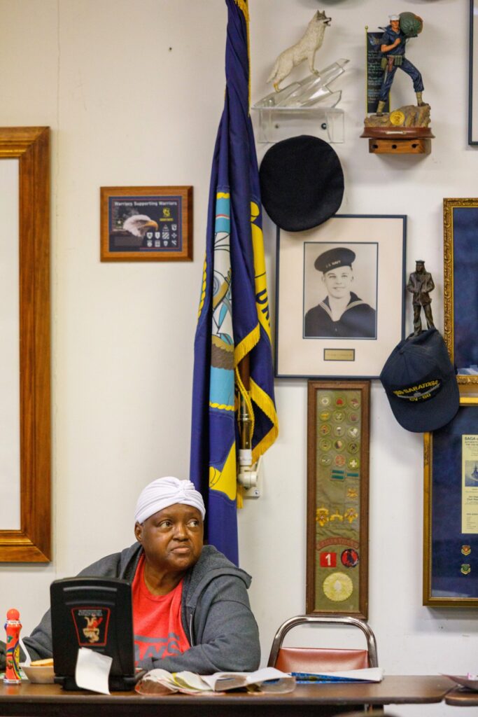 Shiela plays bingo at VFW Post 2811 in Gainesville surrounded by military memorabilia and other artifacts displayed throughout the post during a Sunday afternoon game. Photo by Walker Smith