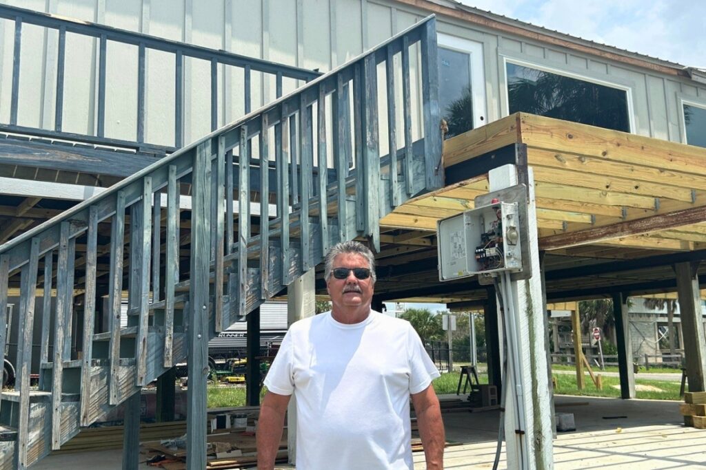 Steinhatchee Chamber President Mark Reblin stands in front of the new Chamber building that is under construction. Photo by Ronnie Lovler