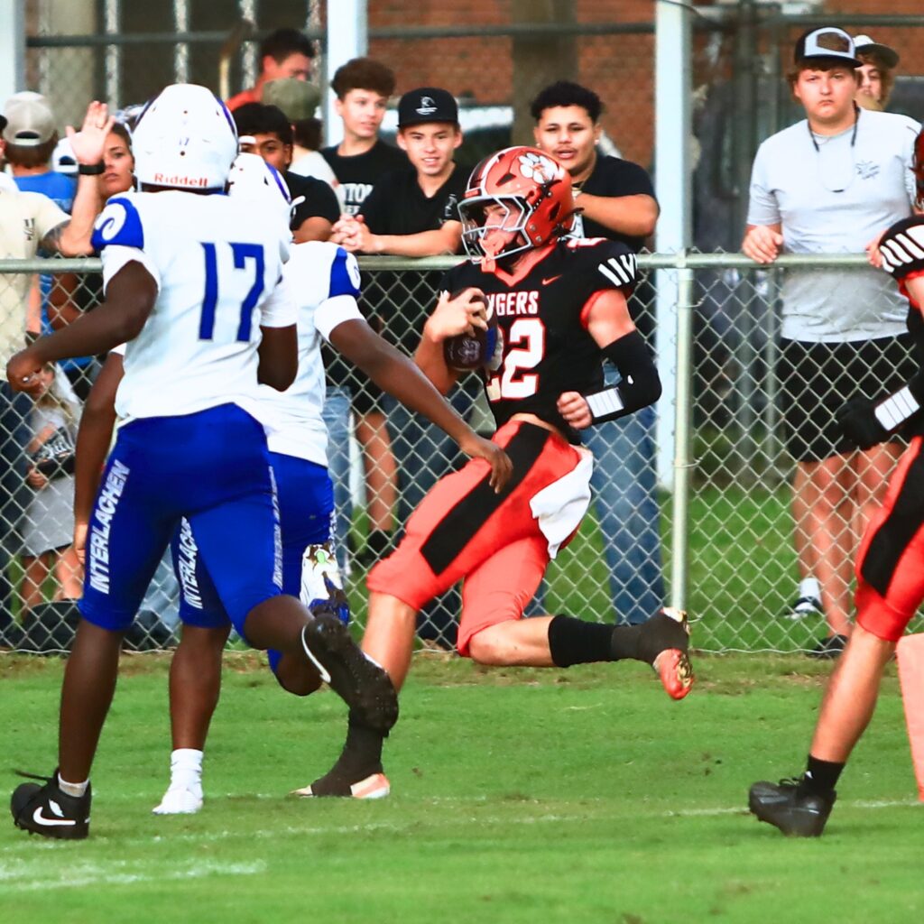 Trenton's Wyatt Vanlandingham (22) scores on a blocked punt return in the first quarter against Interlachen on Friday. Photo by C.J. Gish