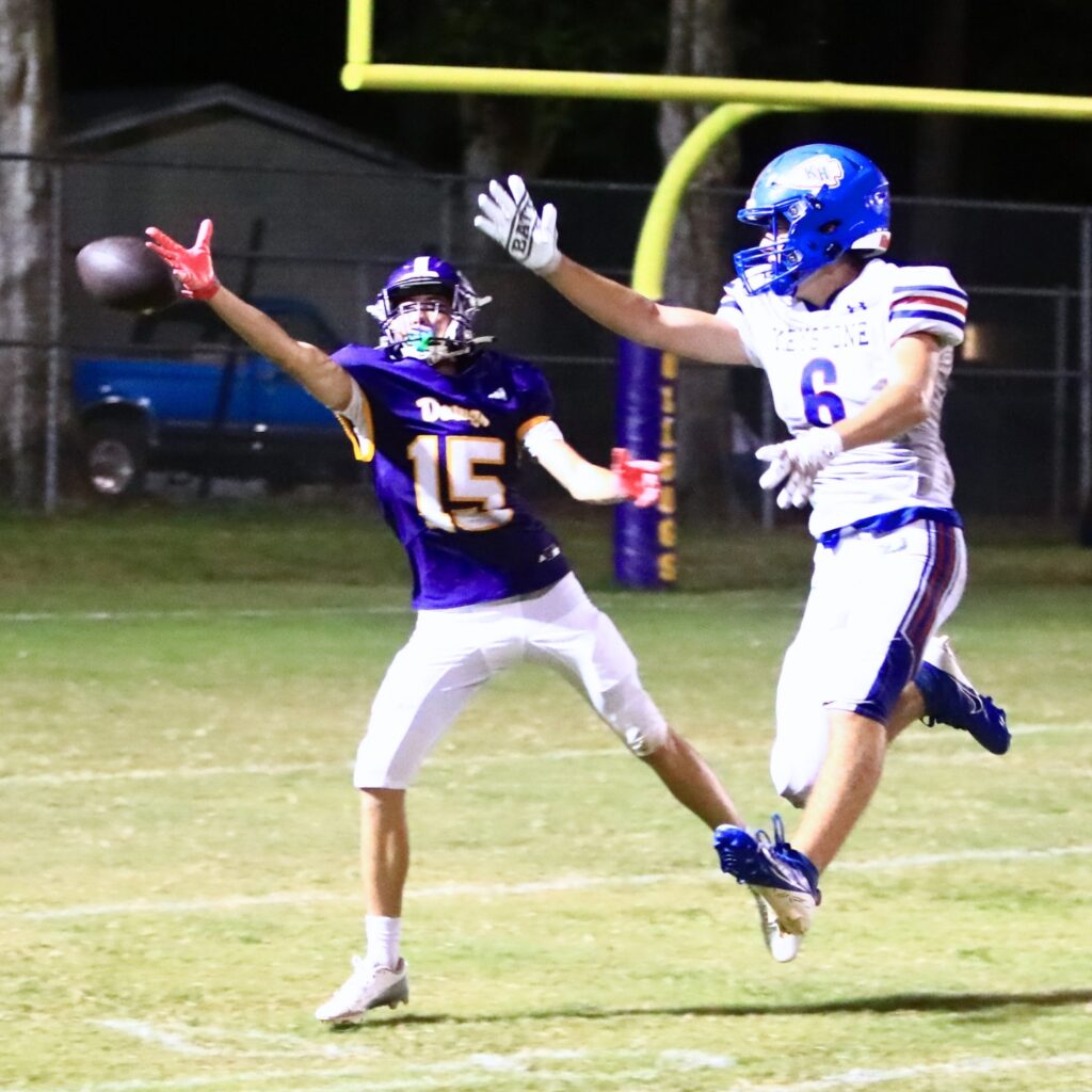 An overthrown ball goes past Keystone Heights' wide receiver Micah Screen (6) and Bell defensive back Lane Sheffield (15) in the third quarter. Photo by C.J. Gish