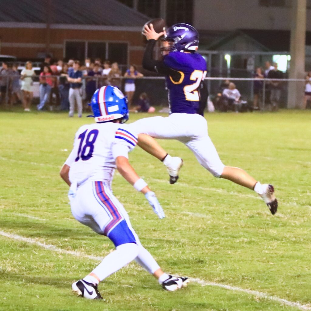 Bell's Dean Glass (21) with a fourth-quarter interception against Keystone Heights. Photo by C.J. Gish