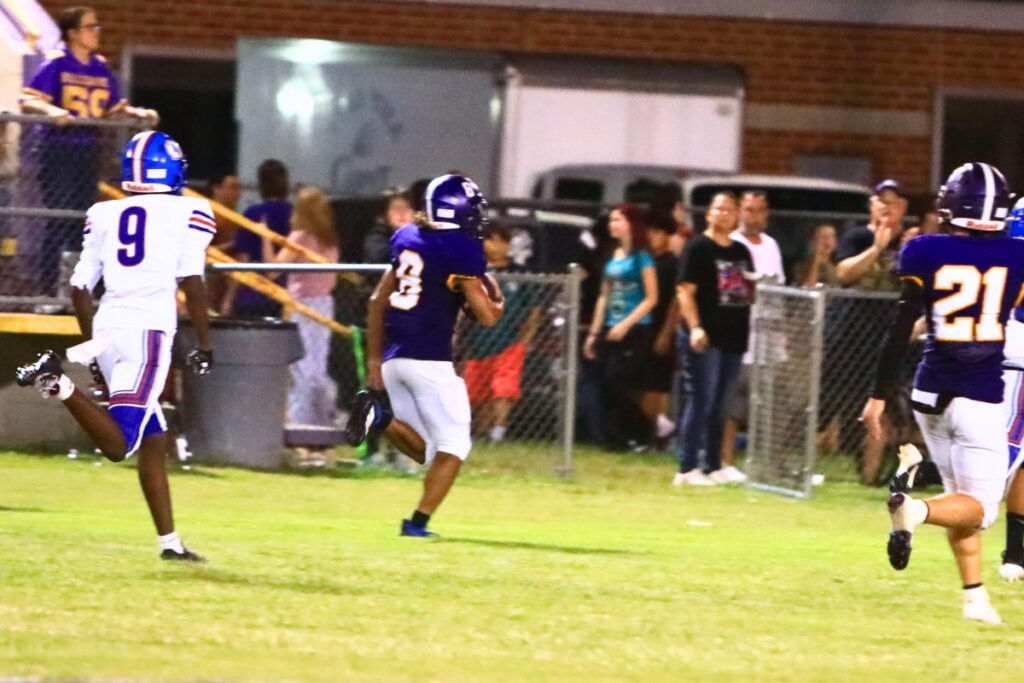 Bell's Kaleb Williams (8) runs 70 yards for a third-quarter touchdown against Keystone Heights. Photo by C.J. Gish