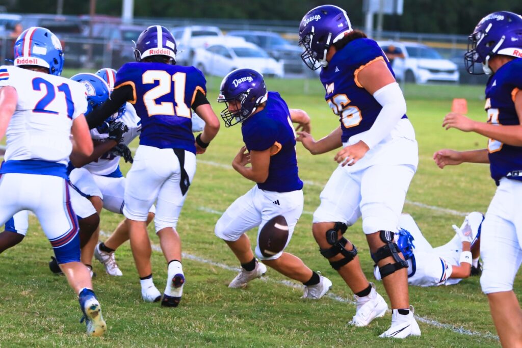 Bell's RJ Leffler fumbles the ball in the first quarter and Keystone Heights recovers. Photo by C.J. Gish