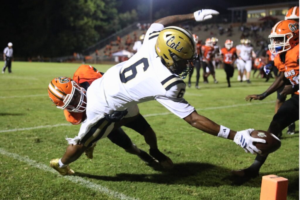 Buchholz's Dominik Harvey (6) dives for the end zone against Eastside on Friday. Photo by Walker Smith