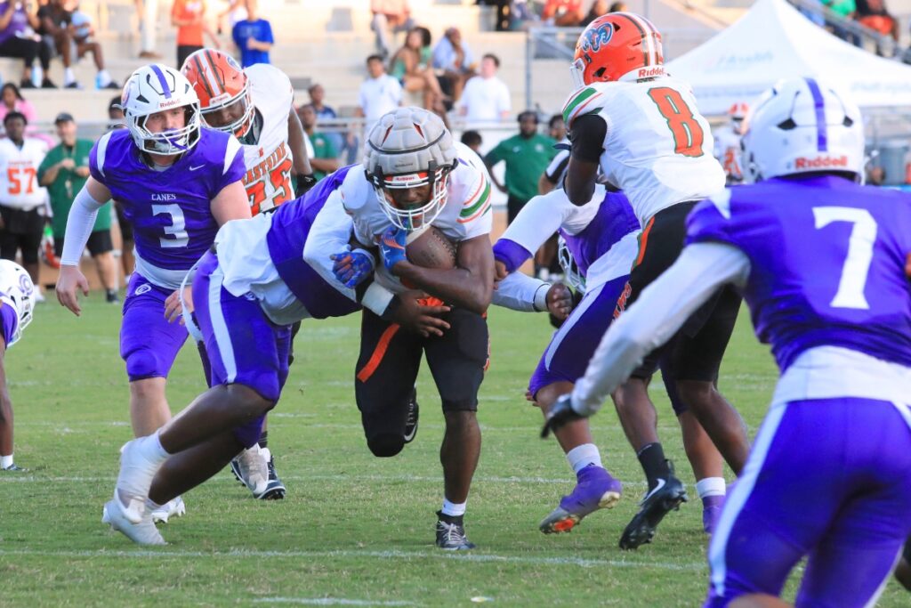 Eastside's Braeden Brockington (6) barrels through the Hurricane defense to earn first and goal positioning. Photo by Seth Johnson