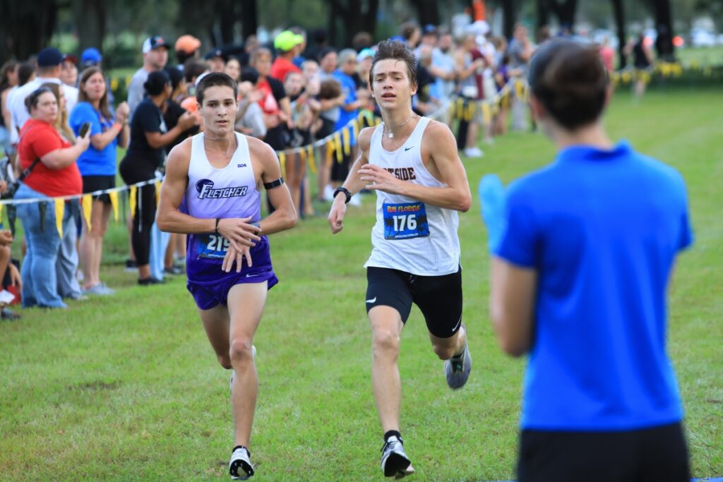 Eastside's Luke Engels and Fletcher's Evan Kirby crossed the line with the same time down to a tenth of a second, but Kirby ended with the second-place position. Photo by Seth Johnson
