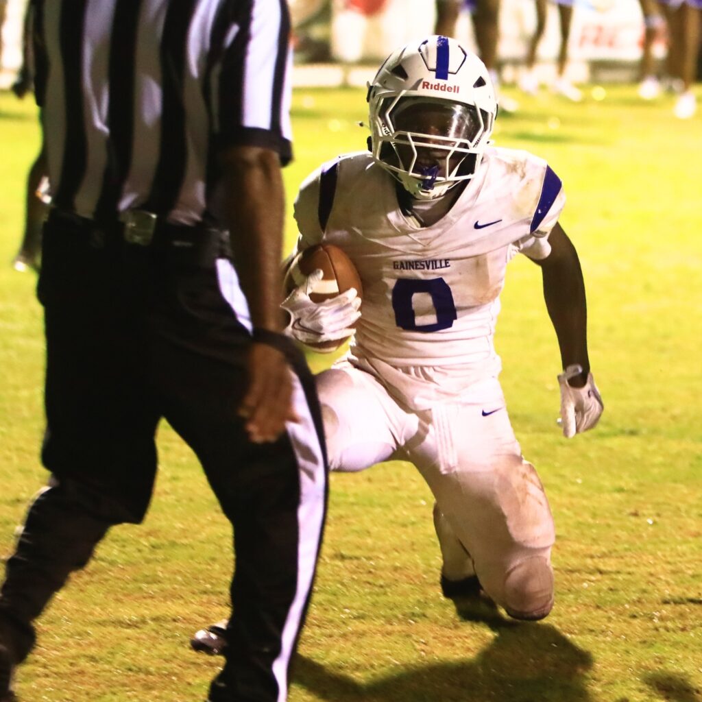 Gainesville's Javaris Gardner (0) scores on a 1-yard plunge in the third quarter against Suwannee (Live Oak) on Friday. Photo by C.J. Gish