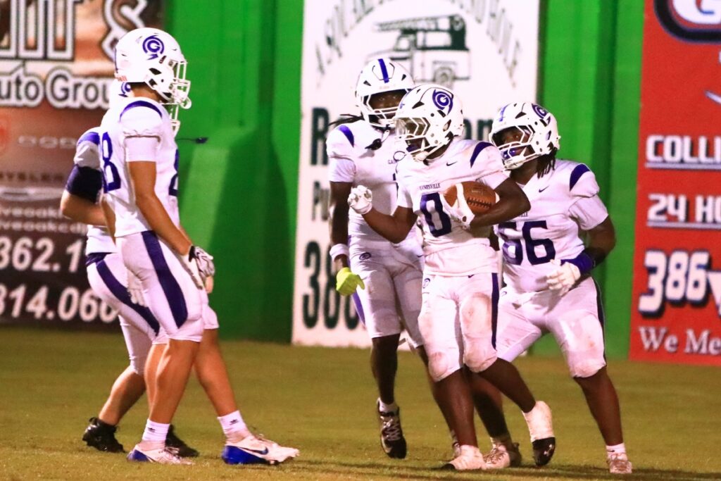 Gainesville's Javaris Gardner (0) scores on a 32-yard screen pass in the second quarter against Suwannee (Live Oak) on Friday. Photo by C.J. Gish