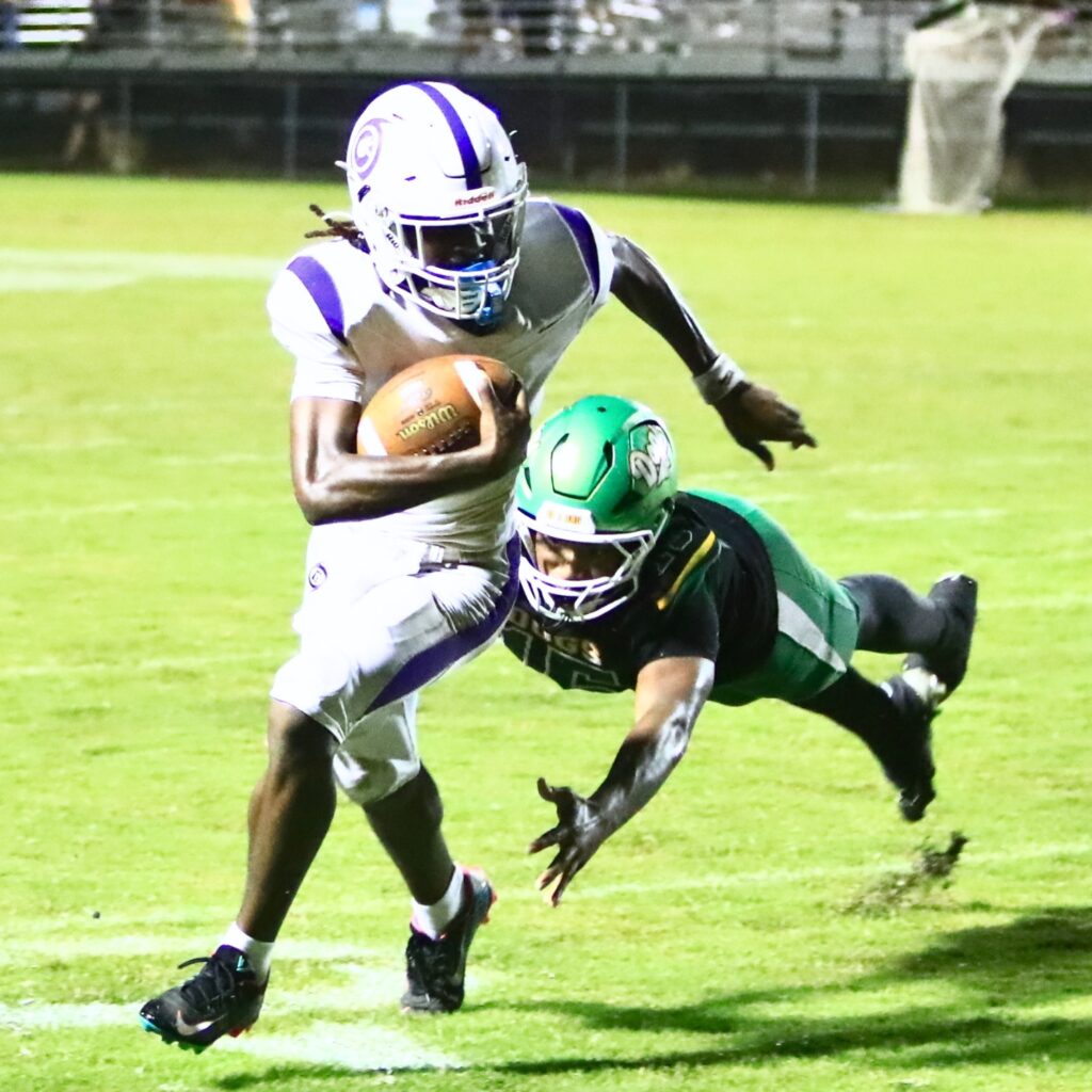 Gainesville's Josh McClellan (5) on a quarterback sweep in the fourth quarter against Suwannee (Live Oak) on Friday. Photo by C.J. Gish