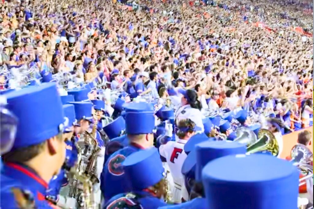 The Gator Pep Band playing as fans do the Gator Chomp at a Florida football game. Courtesy of UF Band