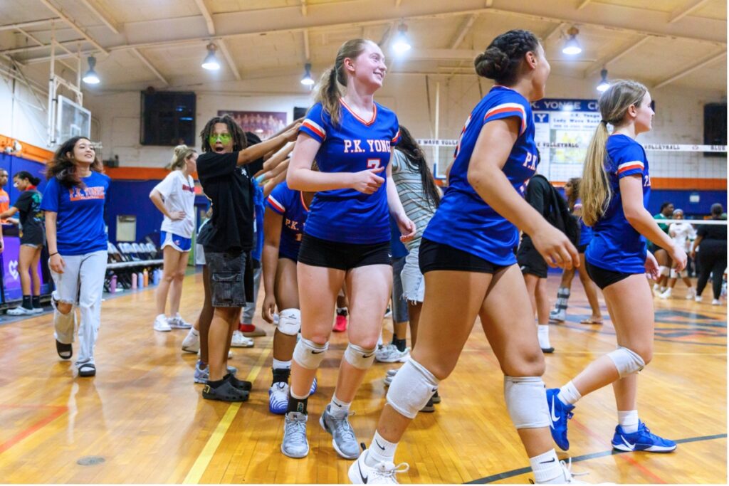 The P.K. Yonge varsity volleyball team celebrates after its win against Eastside on Tuesday. Photo by Walker Smith