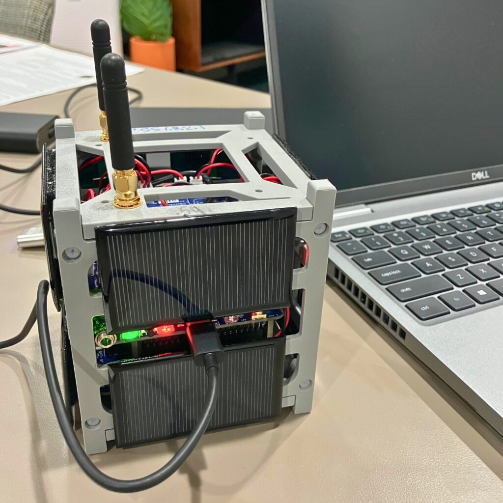 A life-sized satellite simulator demonstrated at AMSAT meeting. Courtesy of NFARC