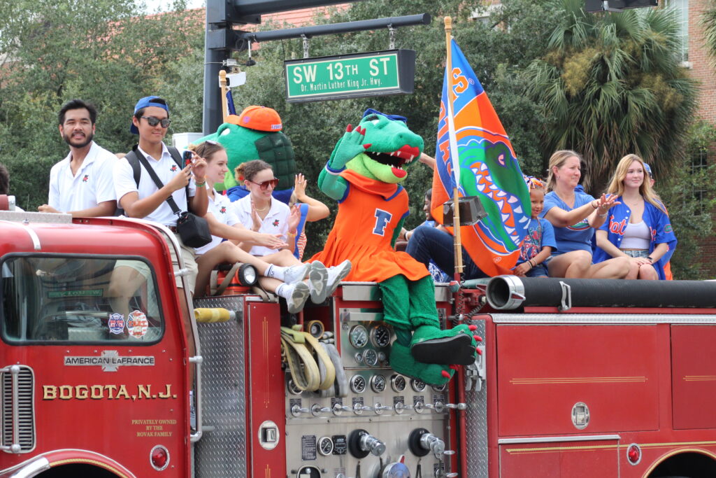 Alberta waves during the UF Homecoming Parade. (Photo by Nick Anschultz)