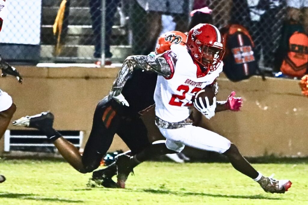 Bradford's Maliki Cobarris (23) with a second-quarter interception against Eastside at Citizens Field on Friday. Photo by C.J. Gish