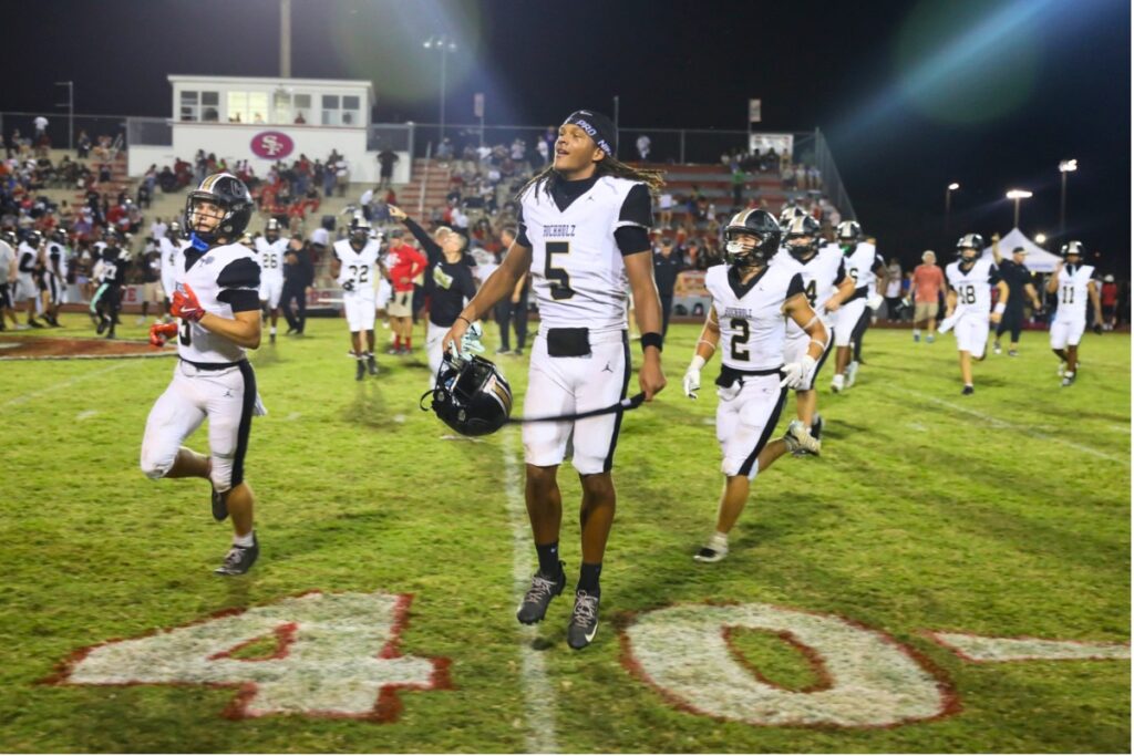 Buchholz football players celebrate after their win against Santa Fe on Thursday night at Santa Fe High School. Photo by Walker Smith