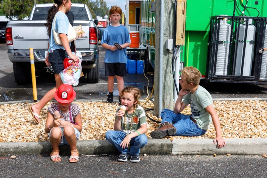 Children cool down with ice cream during the Central Florida Peanut Festival on Saturday in Williston. Photo by Walker Smith