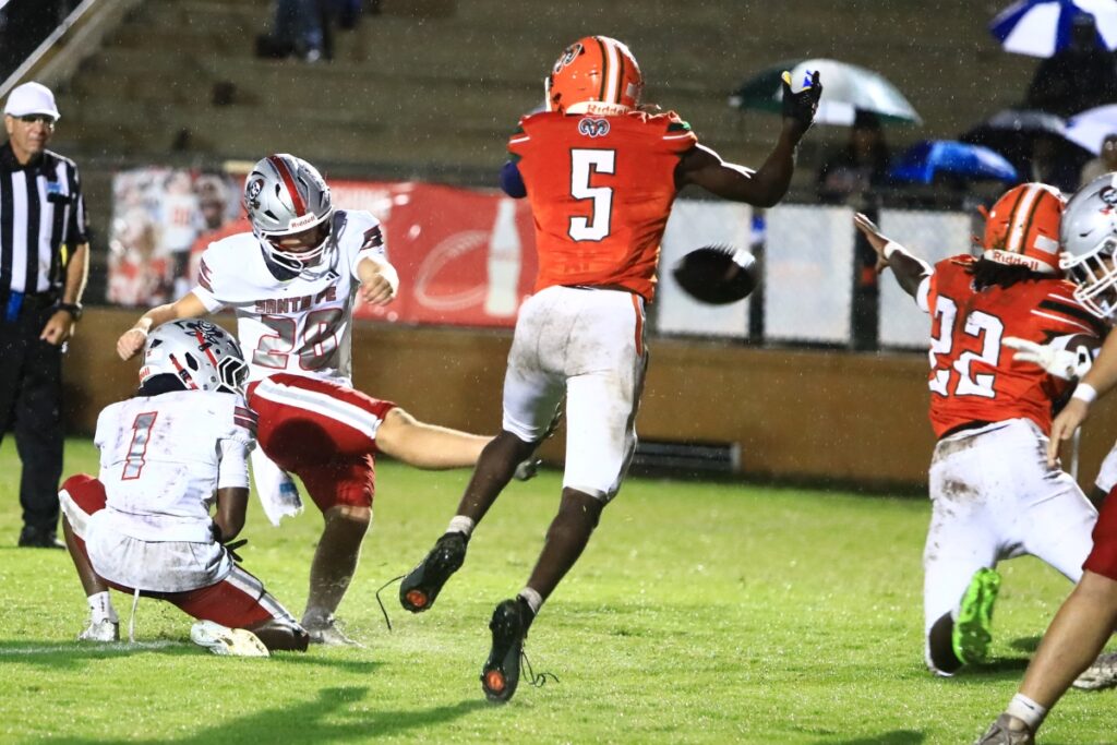 Eastside attempts to block Santa Fe's Mayer Steen (28) extra point kick on Thursday. Photo by C.J. Gish