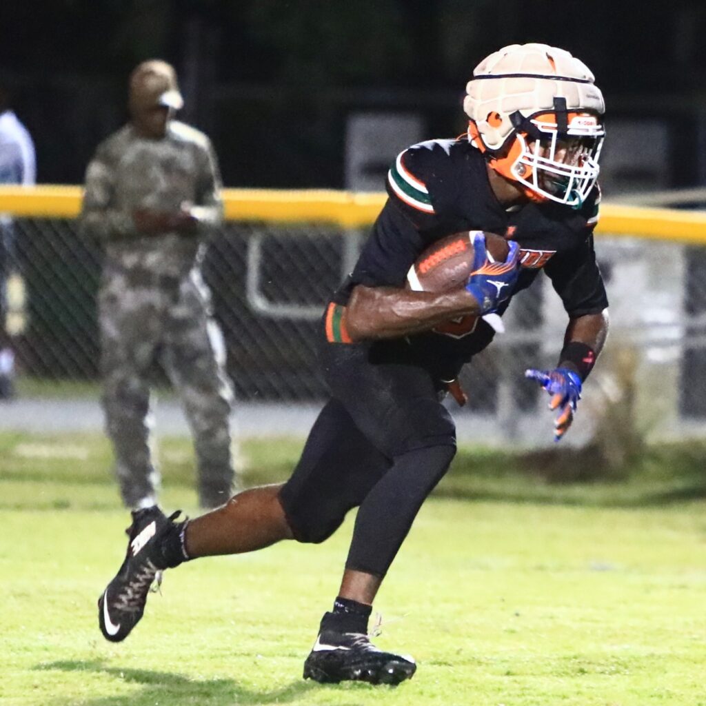 Eastside's Braeden Brockingtom (6) returned a kickoff for a touchdown in the second quarter against Bradford at Citizens Field on Friday. Photo by C.J. Gish
