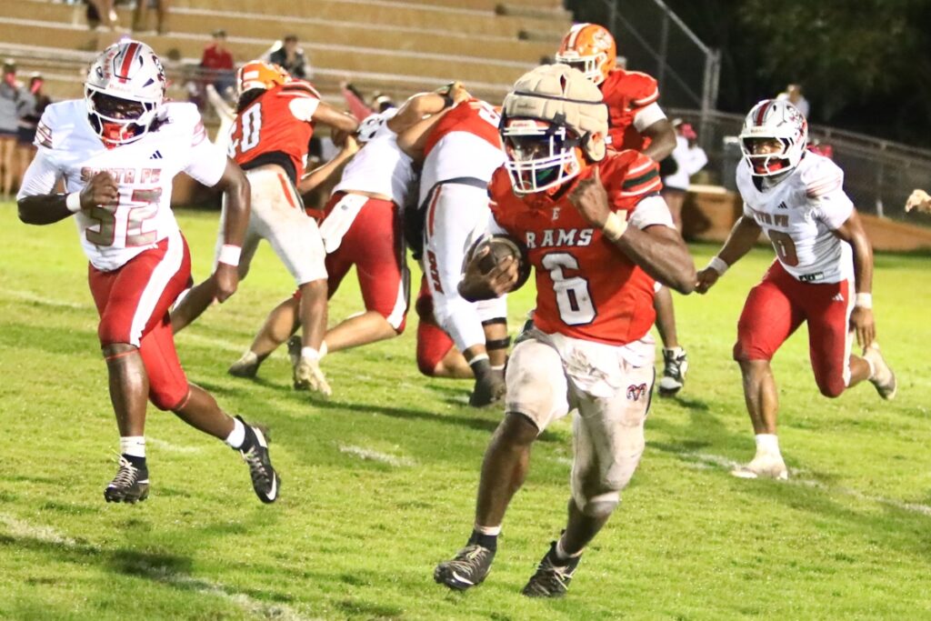 Eastside's Braeden Brockington (6) races 67 yards for a touchdown late in the second quarter against Santa Fe. Photo by C.J. Gish