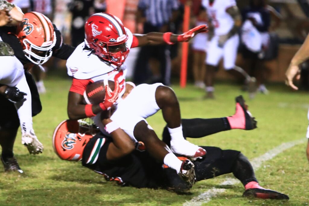 Eastside's Deontae Jones (33) tackles Bradford's Iyen Addison (6) in the first quarter on Friday. Photo by C.J. Gish