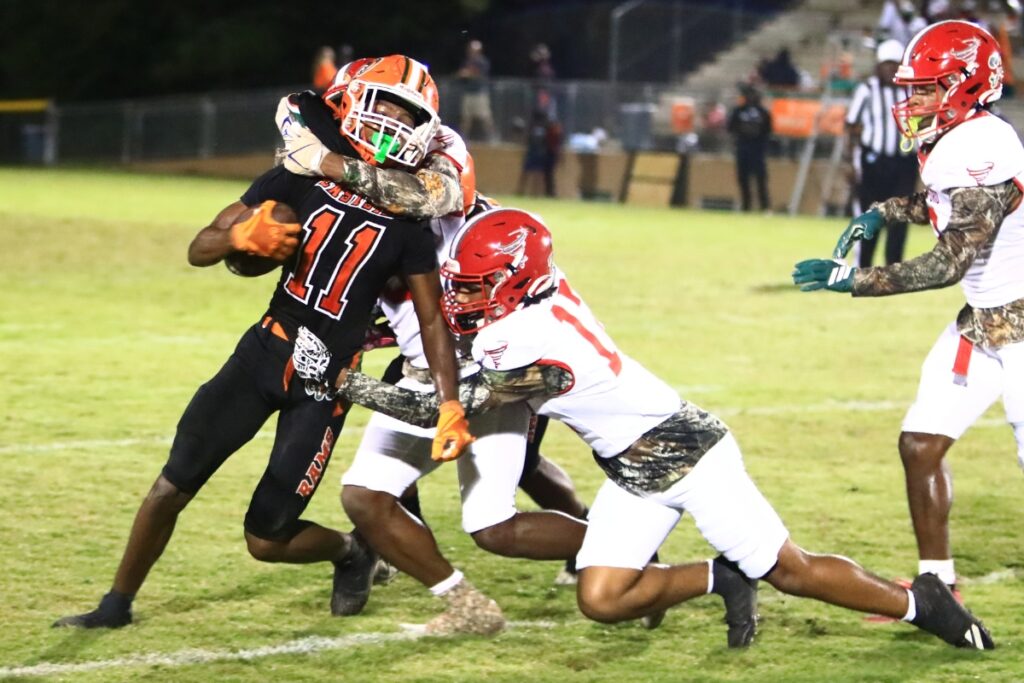 Eastside's Malicah Williams (11) battles for yards following a second-quarter catch against Bradford (Starke) at Citizens Field on Friday. Photo by C.J. Gish