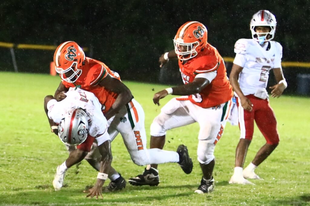 Eastside's Quintin Lewis Jr. (43) tackles Santa Fe's Jadathun Bryant (1) for a loss on Thursday. Photo by C.J. Gish