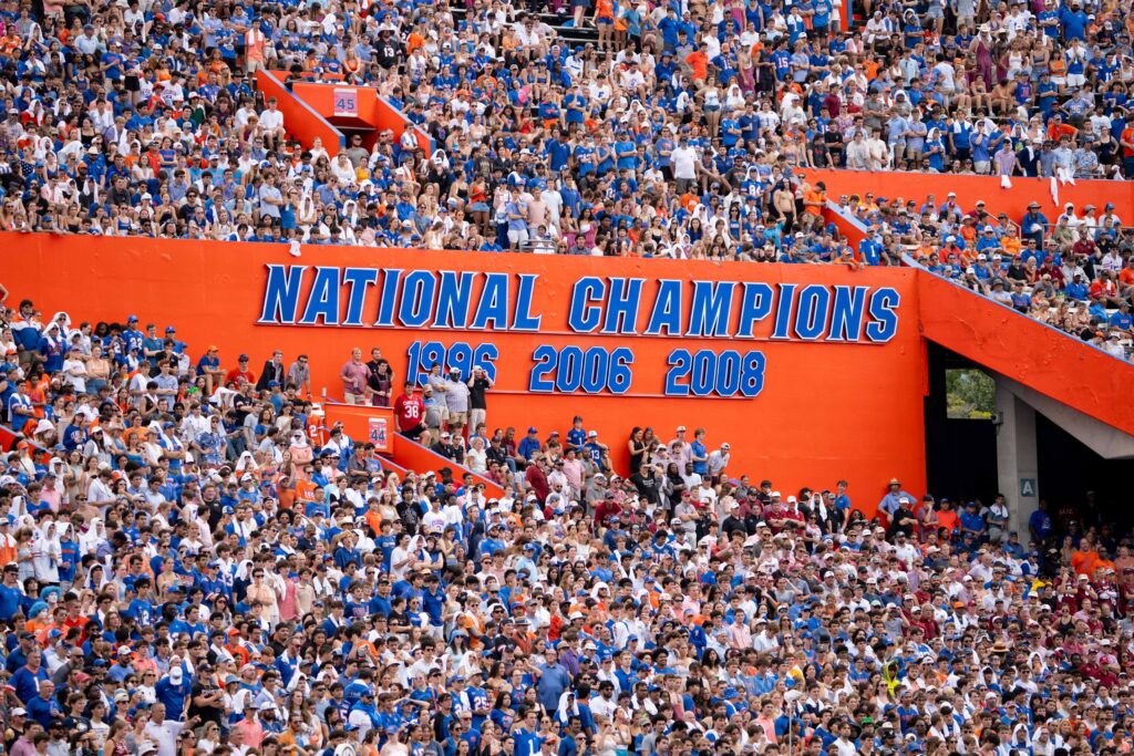 Fans fill the stands beneath Florida’s national championship display during Saturday’s game against South Carolina at Ben Hill Griffin Stadium. Photo by Tim Rodriquez