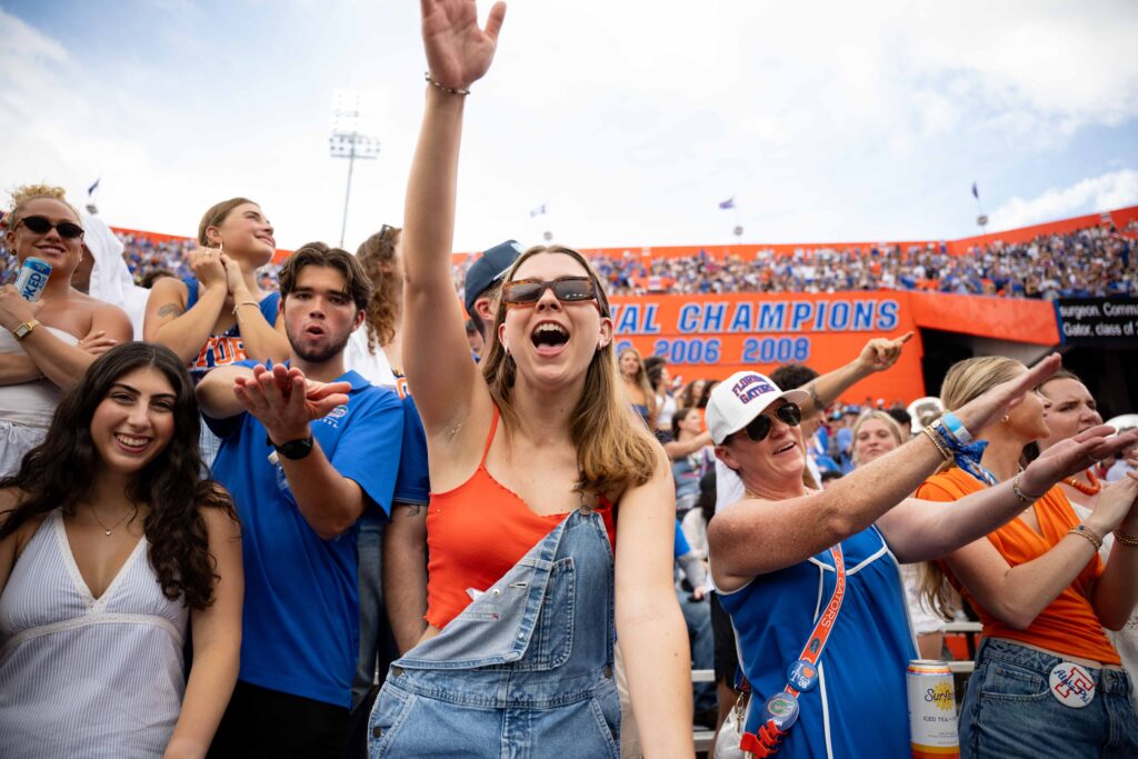 Florida fans cheer and perform the Gator Chomp during Saturday’s game against South Carolina at Ben Hill Griffin Stadium.