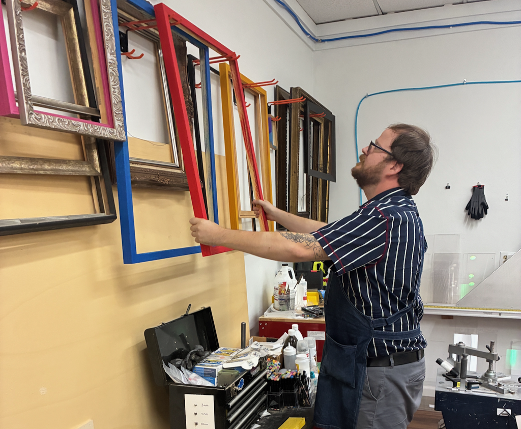 Owner Brett working with colored frame