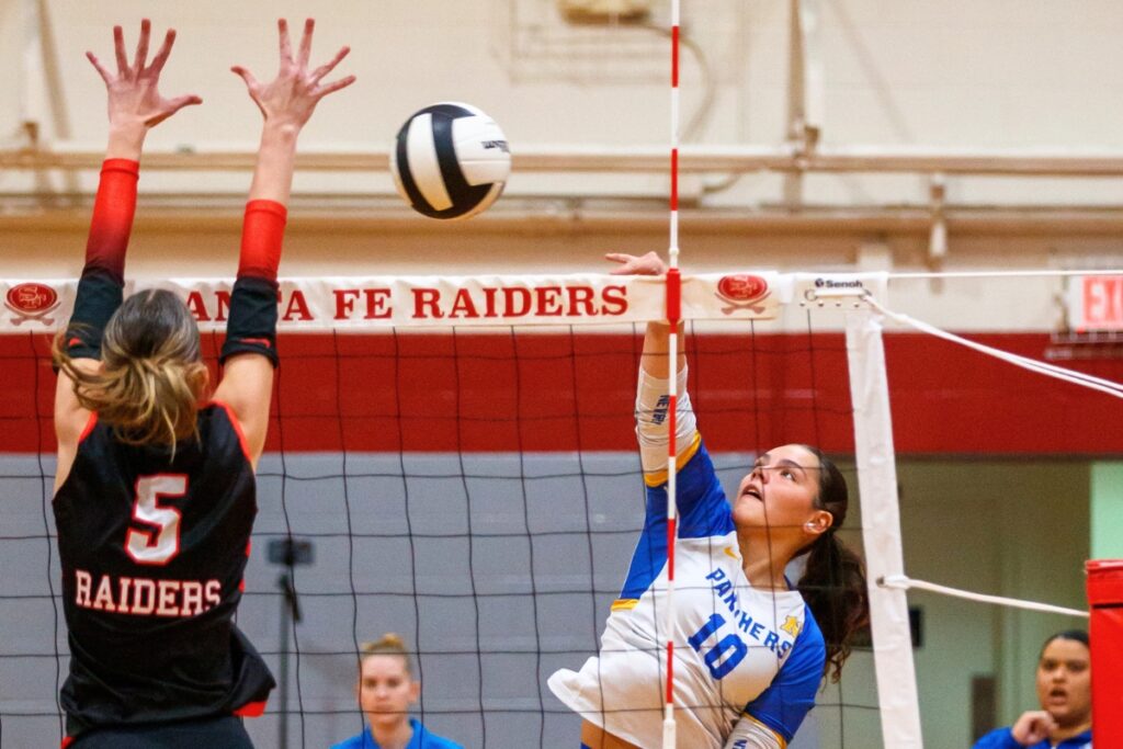 Newberry's Taylor Wells (10) sends the ball toward Santa Fe's Ella Schneider (5) during the Class 3A-District 5 title match on Thursday. Photo by Walker Smith