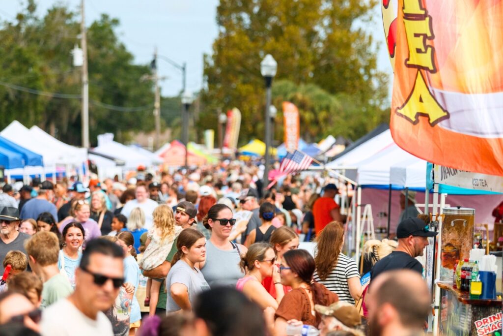 Record-setting crowds gathered along the vendor walkway at the Central Florida Peanut Festival on Saturday in Williston. Photo by Walker Smith