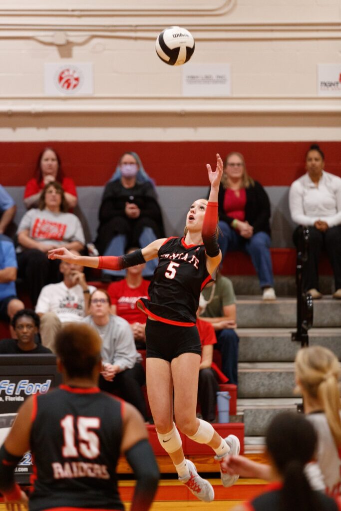 Santa Fe's Ella Schneider leaps to return the ball in the Class 3A-District 5 championship match against Newberry on Thursday. Photo by Walker Smith
