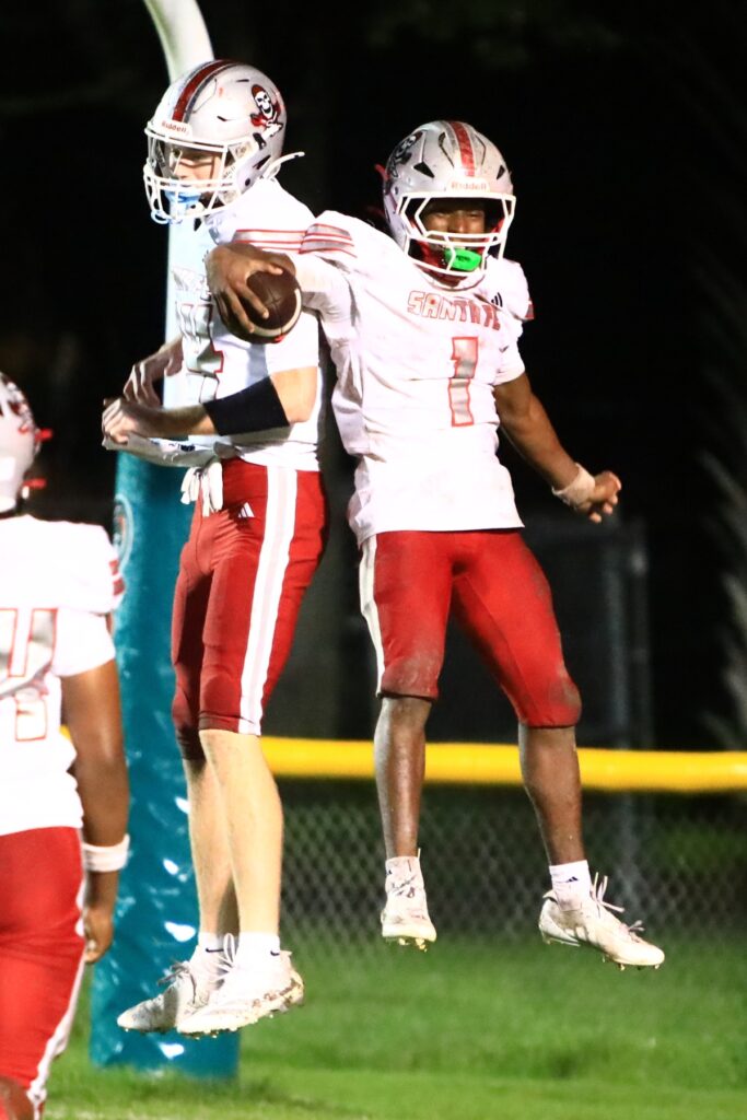 Santa Fe's Jadathun Bryant (1) celebrates after scoring a touchdown in the second quarter for a 21-7 lead over Eastside. Photo by C.J. Gish
