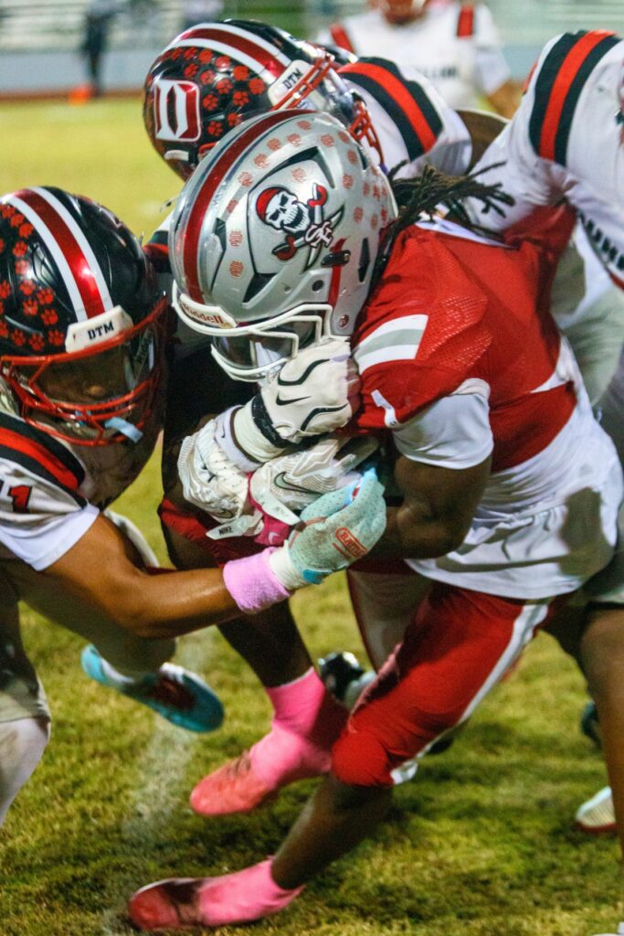 Santa Fe's Jadathun Bryant is stopped by Dunnellon's defense on Thursday. Photo by Walker Smith