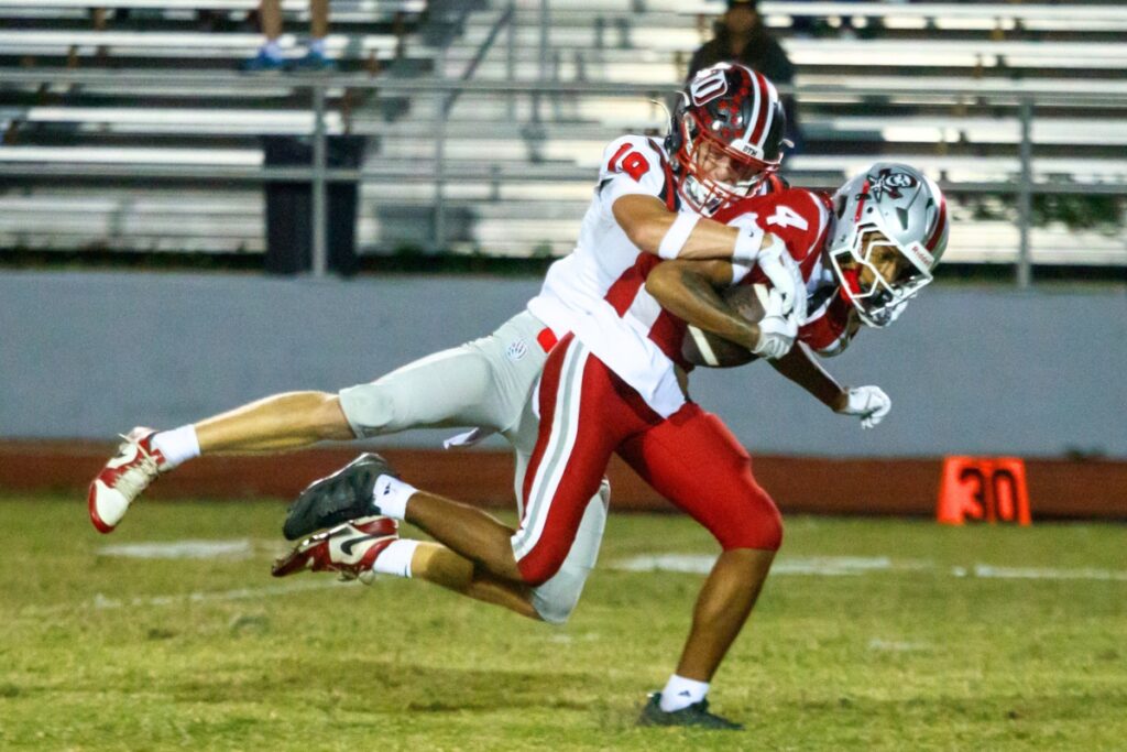 Santa Fe's Kayoni Briggs catches a pass during a game against Dunnellon on Thursday. Photo by Walker Smith